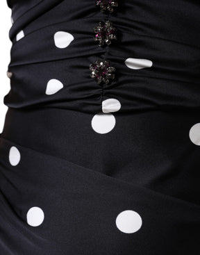 Dolce & Gabbana Schwarzes gepunktetes Midikleid aus Seide mit V-Ausschnitt und Quasten