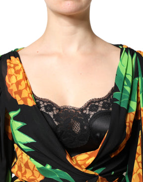 Dolce & Gabbana Schwarzes Seiden-Wickelkleid mit drapiertem Ananas-Print