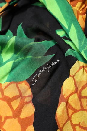 Dolce & Gabbana Schwarzes Seiden-Wickelkleid mit drapiertem Ananas-Print