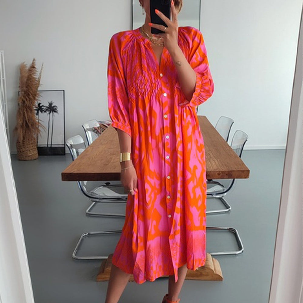 Winterblume: Leuchtendes Hot-Pink-Orange-Print-Midi-Kleid für farbenfrohe Wintertage